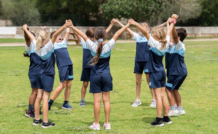 Ethos children playing hand in hand
