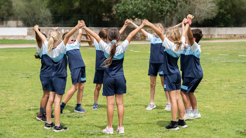 Ethos children playing hand in hand