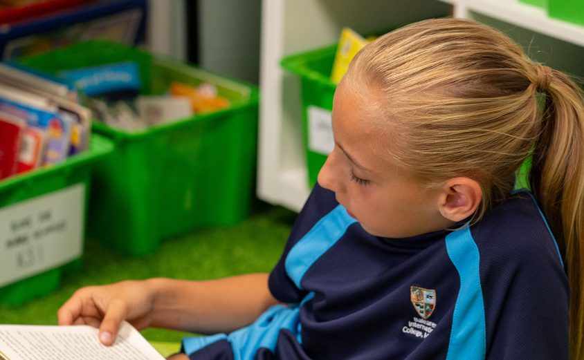 FRS 2791 child reading at the library