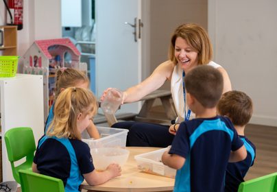 Elizabeth Compton helping children in our nursery year group learn through play