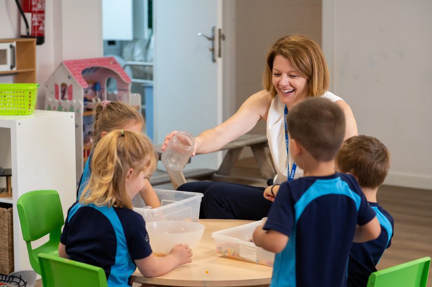 Elizabeth Compton helping children in our nursery year group learn through play