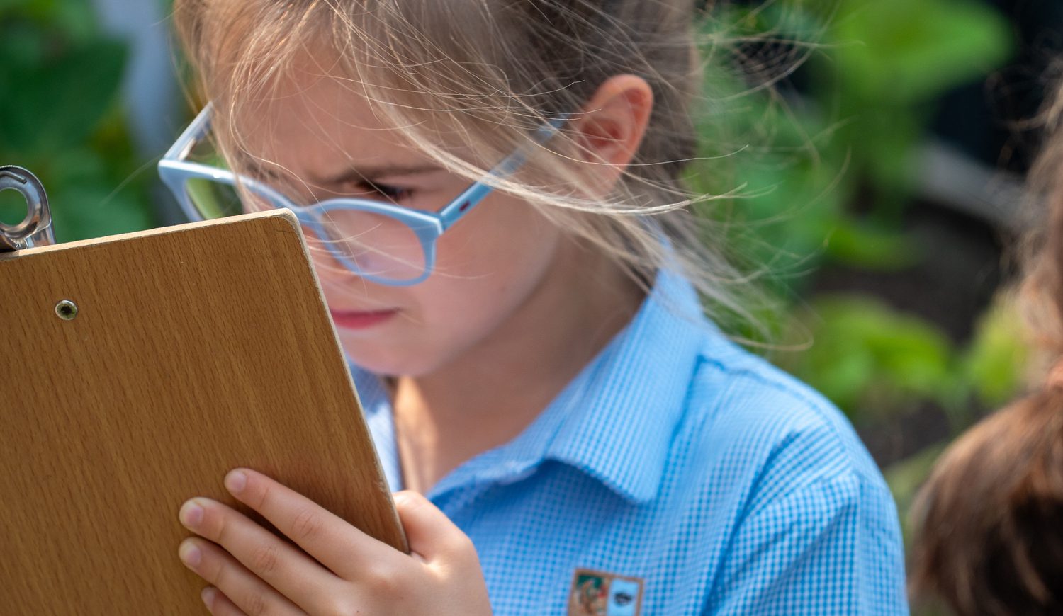 Girl making notes outdoor