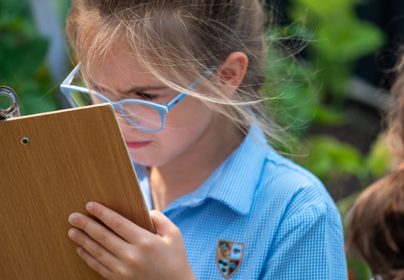 Girl making notes outdoor