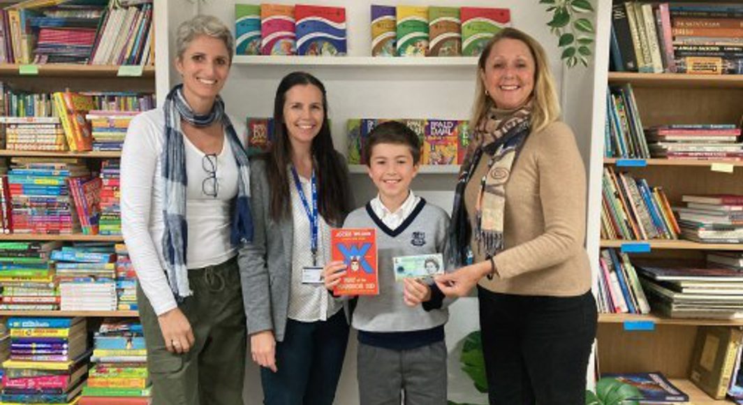 Oliver winning the Come in Bookshop voucher