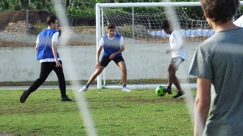 Boys playing football outside