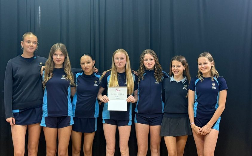 Group of dancers in sports clothes smiling with the special mention award