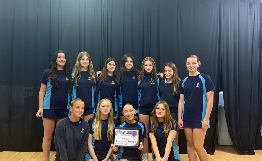 Group of girl dancers with Award in their sports clothes
