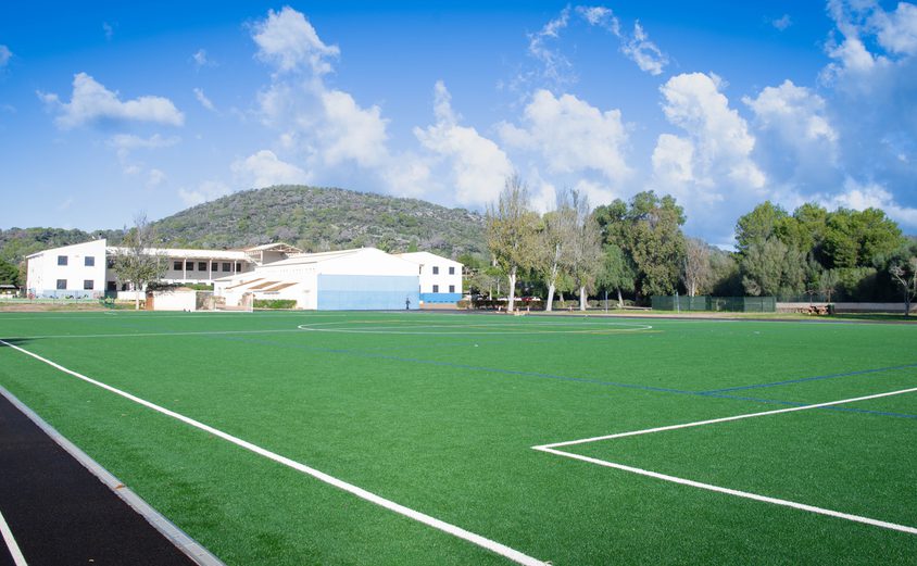 Astro Turf with School in background